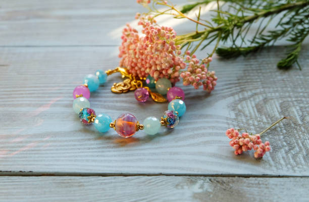 Summer beaded bracelet color ideas using a professional bracelet-making kit with blue and candy-colored beads.
