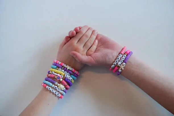 Two matching friendship bracelets in inverted colors